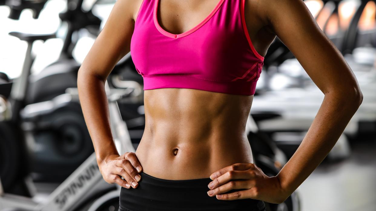  a photo of a woman with strong abdominal muscles  