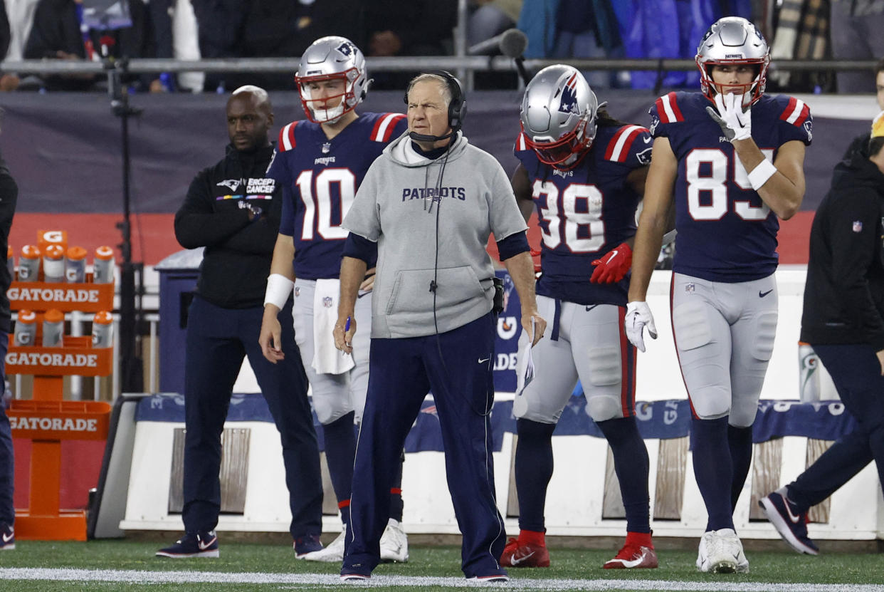 FOXBOROUGH, MA - OCTOBER 24: A benched New England Patriots quarterback Mac Jones (10) watches from the sidelines during a game between the New England Patriots and the Chicago Bears on October 24, 2022, at Gillette Stadium in Foxborough, Massachusetts. (Photo by Fred Kfoury III/Icon Sportswire via Getty Images)