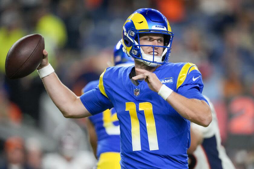 Los Angeles Rams quarterback Brett Rypien passes against the Denver Broncos.