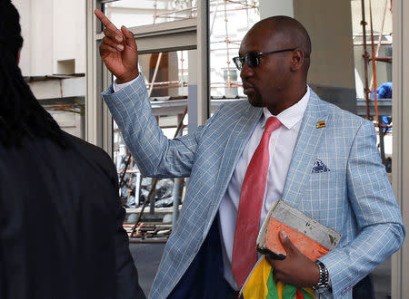 Activist Pastor Evan Mawarire who is facing charges of attempting to subvert the government arrives at the High Court in Harare, Zimbabwe, November 29, 2017. REUTERS/Philimon Bulawayo