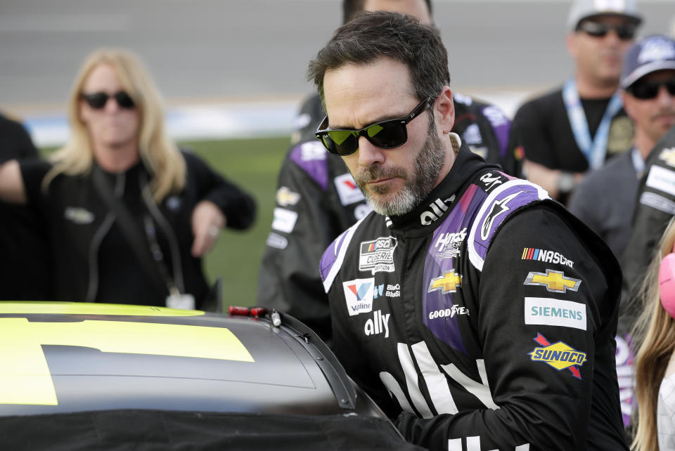 Jimmie Johnson climbs intp his car before the NASCAR Daytona 500 auto race at Daytona International Speedway, Sunday, Feb. 16, 2020, in Daytona Beach, Fla. (AP Photo/John Raoux)