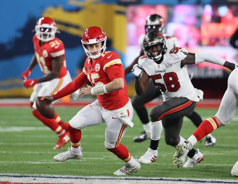 Kansas City Chiefs quarterback Patrick Mahomes is chased by Tampa Bay Buccaneers outside linebacker Shaquil Barrett (58) in the second half of the Chiefs' 31-9 loss in Super Bowl LV at Raymond James Stadium in Tampa, Fla. on Feb. 7, 2021.