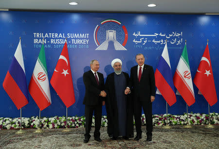 President Vladimir Putin of Russia, Hassan Rouhani of Iran and Tayyip Erdogan of Turkey meet in Tehran, Iran September 7, 2018. Cem Oksuz/Turkish Presidential Palace/Handout via REUTERS