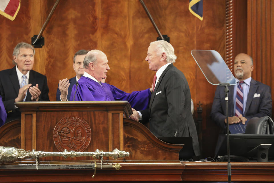 South Carolina Senate President Thomas Alexander, R-Walhalla, center left, shakes the hand of Gov. Henry McMaster before McMaster gives his State of the State address on Wednesday, Jan. 24, 2024, in Columbia, S.C. (AP Photo/Jeffrey Collins)