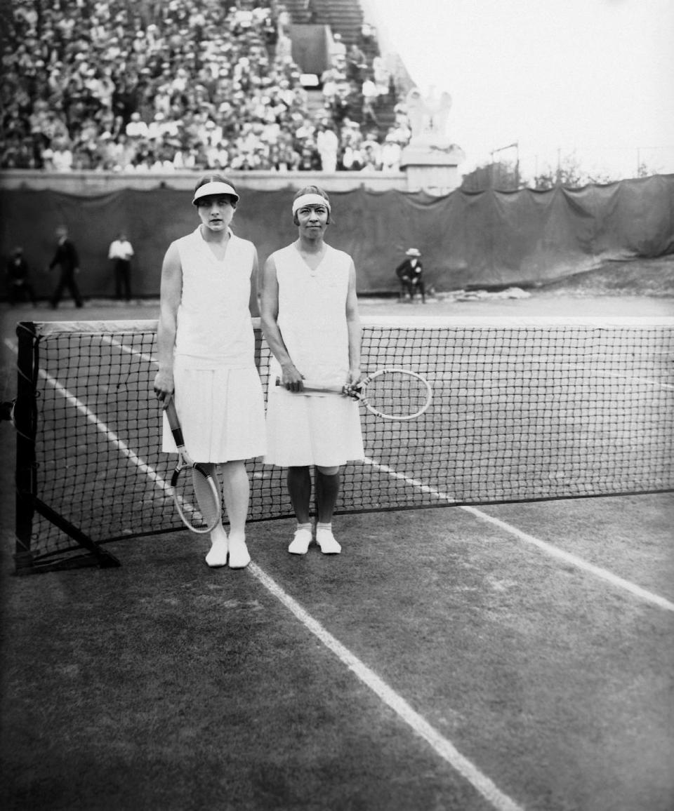 FILE - In this file photo of August 25, 1927, defending champion Molla Mallory, right, poses with Helen Wills Moody during the Women’s National Singles Championship at the West Side Tennis Club in the Forest Hills neighborhood of the Queens borough of New York. The stadium that was one of the cathedrals of tennis and hosted US Open tennis for six decades, as well as music greats, is planning to revive the sound of music at the 16,000-seat stadium and perhaps, one day, bring back big-time professional tennis. (AP Photo, File)