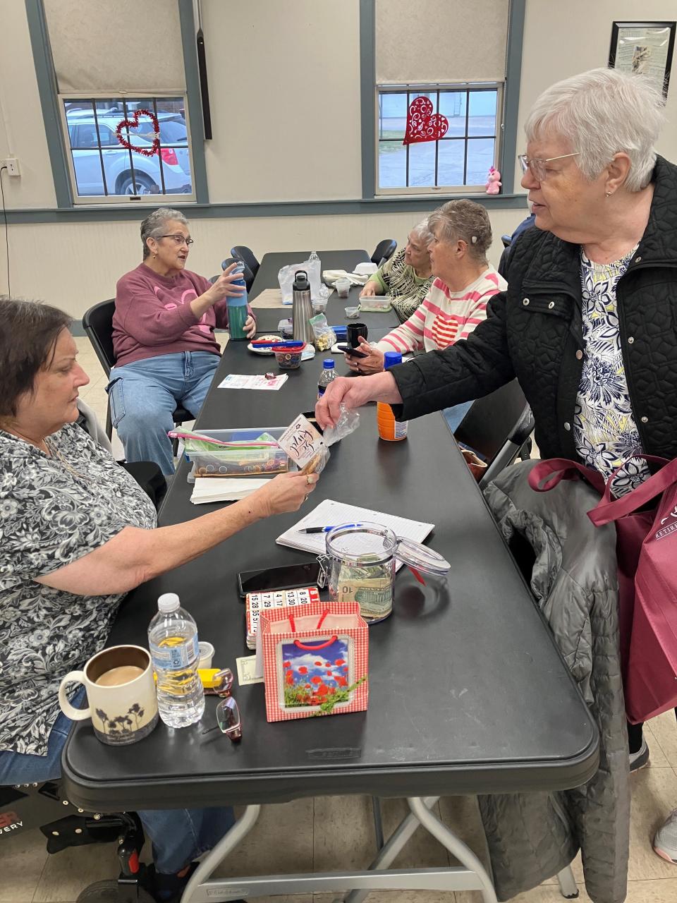 Residents from Primrose Retirement Community recently visited the Lexington Senior Center to hand out cookies and restaurant gift cards. It's one of a number of ways Primrose residents are giving back to the community.