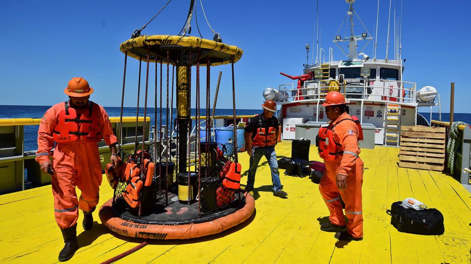 Workers load supplies for the the L/B Myrtle offshore support vessel, part of a 2016 scientific mission led by the International Ocean Discovery Program to study the Chicxulub impact crater on the Gulf of Mexico. The crater was formed after an asteroid hit Earth 66 million years ago. - Ronaldo Schemidt/AFP/Getty Images