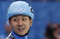 Victor An of Russia smiles after winning in a men's 1000m short track speedskating final at the Iceberg Skating Palace during the 2014 Winter Olympics, Saturday, Feb. 15, 2014, in Sochi, Russia. (AP Photo/Bernat Armangue)