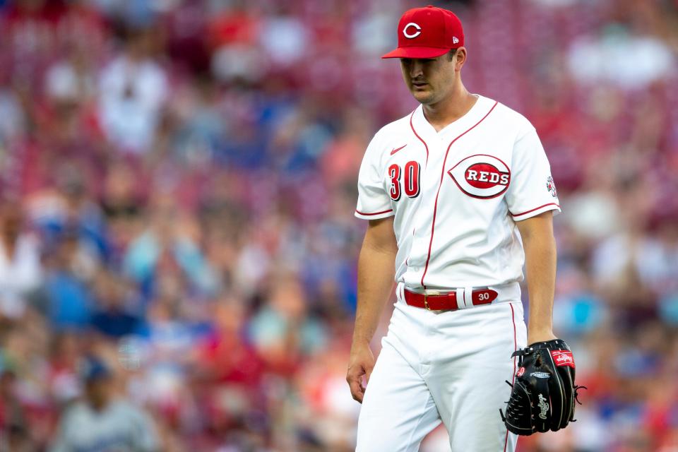 Cincinnati Reds starting pitcher Tyler Mahle (30) walks back to the dugout after striking out the final batter in the top of the second inning of the MLB game between the Cincinnati Reds and the Los Angeles Dodgers in Cincinnati at Great American Ball Park on Tuesday, June 21, 2022. 