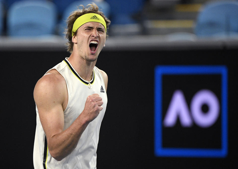 Germany's Alexander Zverev celebrates winnig the second set against Serbia's Dusan Lajovic during their fourth round match at the Australian Open tennis championships in Melbourne, Australia, Sunday, Feb. 14, 2021. (AP Photo/Andy Brownbill)