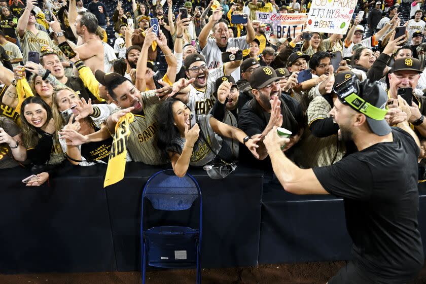 San Diego, CA - October 15: The San Diego Padres fans celebrate after the Padres beat the Los Angeles Dodgers 5-3 in game 4 of the NLDS at Petco Park on Saturday, Oct. 15, 2022 in San Diego, CA. (Wally Skalij / Los Angeles Times)