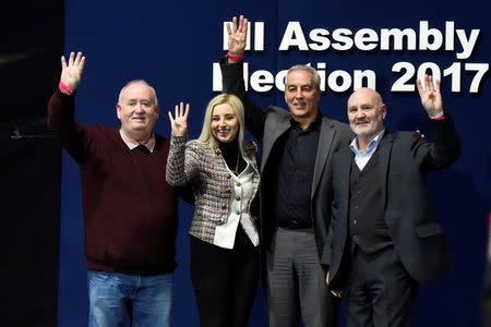 Sinn Fein elected candidates for East Belfast (L to R) Fran McCann, Orlaithi Flynn, Pat Sheehan and Alex Maskey pose on stage at the count centre in Belfast, Northern Ireland March 3, 2017. REUTERS/Clodagh Kilcoyne