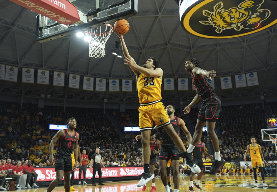 Wichita State's James Rojas (33) scores against Houston during the first half of an NCAA college basketball game in Wichita, Kan., Thursday, Feb. 2, 2023. (Jaime Green/The Wichita Eagle via AP)