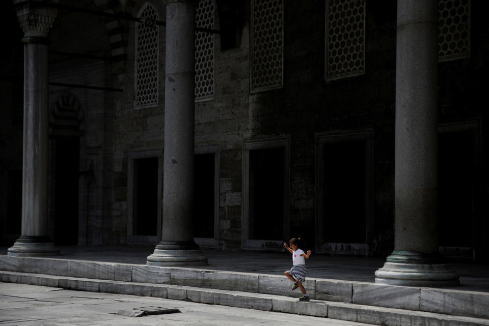 A child runs at the Blue Mosque