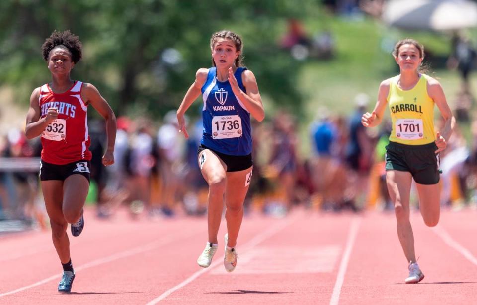 Kapaun’s Lillian Harris wins the 5A 100m dash on Saturday at the Kansas State High School Track and Field Championships at Cessna Stadium.