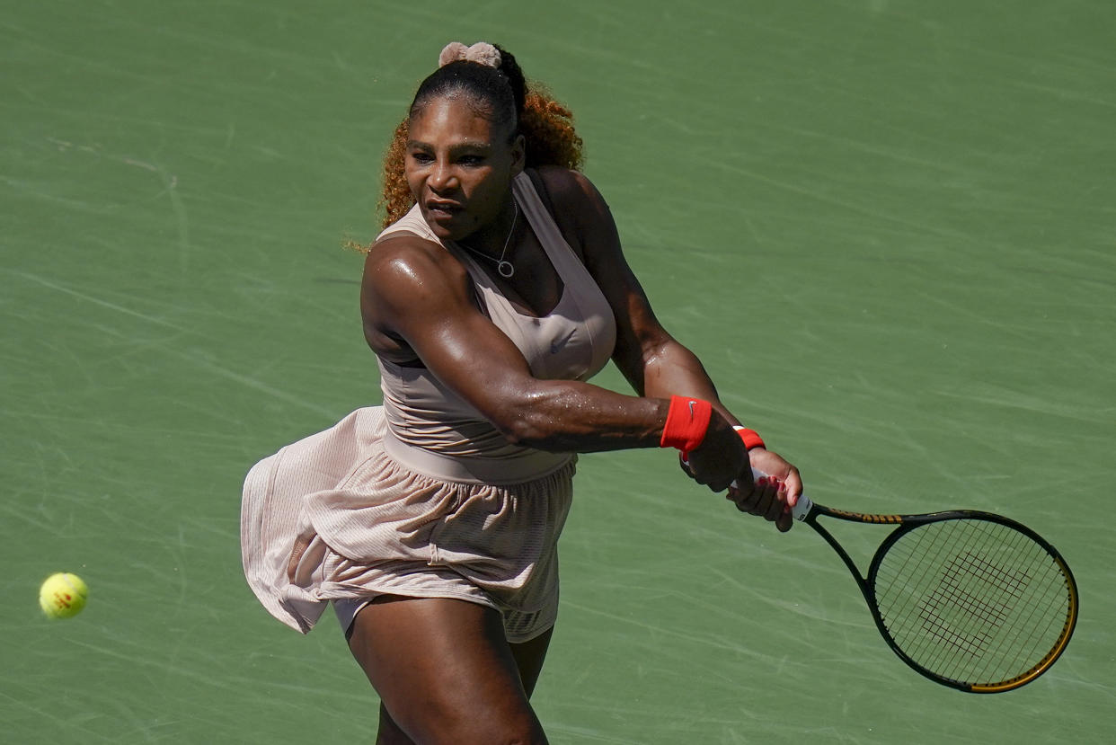 Serena Williams returns a shot to Maria Sakkari.