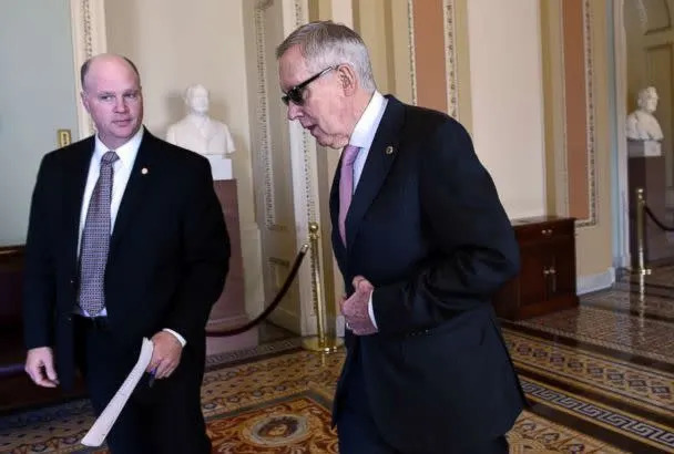 PHOTO: Senate Minority Leader Harry Reid of Nev. walks back to his office following a meeting with Senate Democrats on Capitol Hill in Washington, Friday, May 22, 2015.  (Susan Walsh/AP Photo)