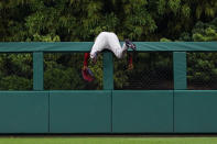 Washington Nationals center fielder Victor Robles cannot reach a home run hit by Philadelphia Phillies' Kyle Schwarber during the first inning of a baseball game, Tuesday, July 5, 2022, in Philadelphia. (AP Photo/Matt Slocum)