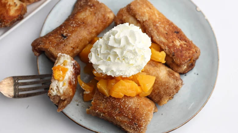 Peaches and whipped cream French toast rolls