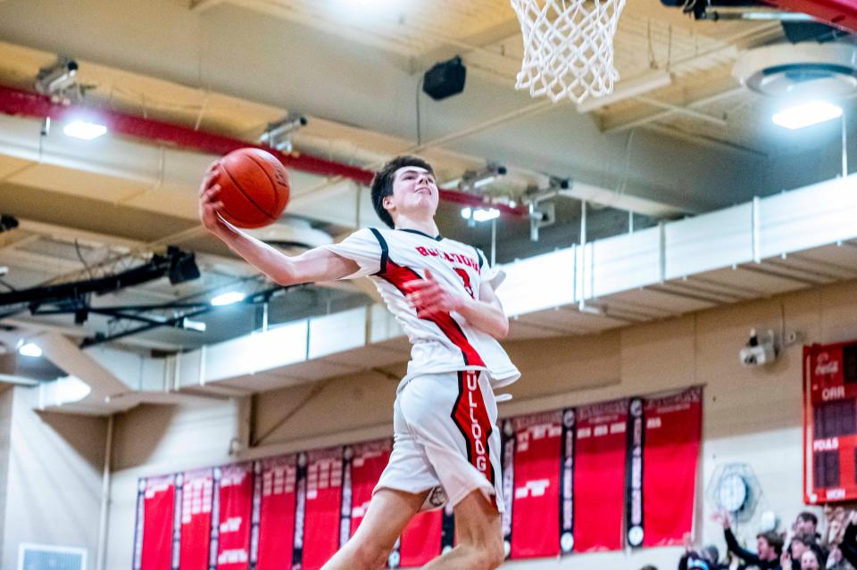 Old Rochester's Sawyer Fox attacks the basket.