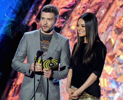 Actors Justin Timberlake (L) and Mila Kunis present an award onstage during the 2011 MTV Movie Awards. Timberlake and Kunis have accepted YouTube invitations from two US Marines, one serving in Afghanistan, to accompany them to military balls