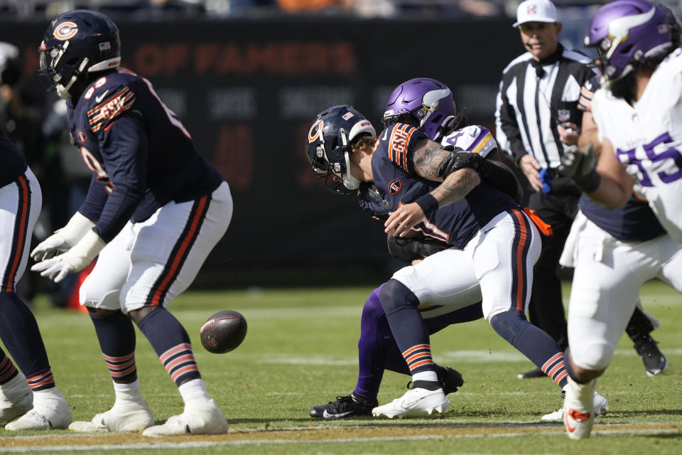 Minnesota Vikings safety Josh Metellus (44) forces Chicago Bears quarterback Tyson Bagent (17) to fumble the ball during the second half of an NFL football game, Sunday, Oct. 15, 2023, in Chicago. (AP Photo/Charles Rex Arbogast)