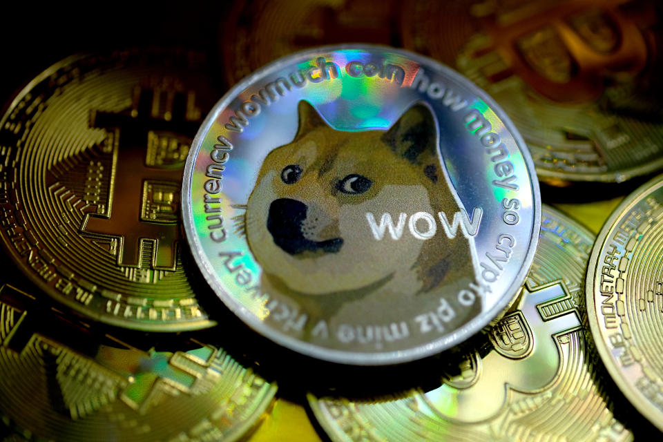 KATWIJK, NETHERLANDS - JANUARY 29: In this photo illustration, visual representations of digital cryptocurrencies, Dogecoin and Bitcoin are arranged on January 29, 2021 in Katwijk, Netherlands.  (Photo by Yuriko Nakao/Getty Images)