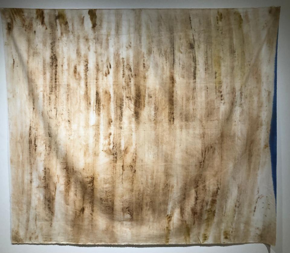 "America's Wall" by Tanya Anguiñiga used a cotton cloth and vinegar to take an impression of the U.S.-Mexico border wall in the "LatinXAmerican" exhibit at the Lubeznik Center for the Arts in Michigan City.