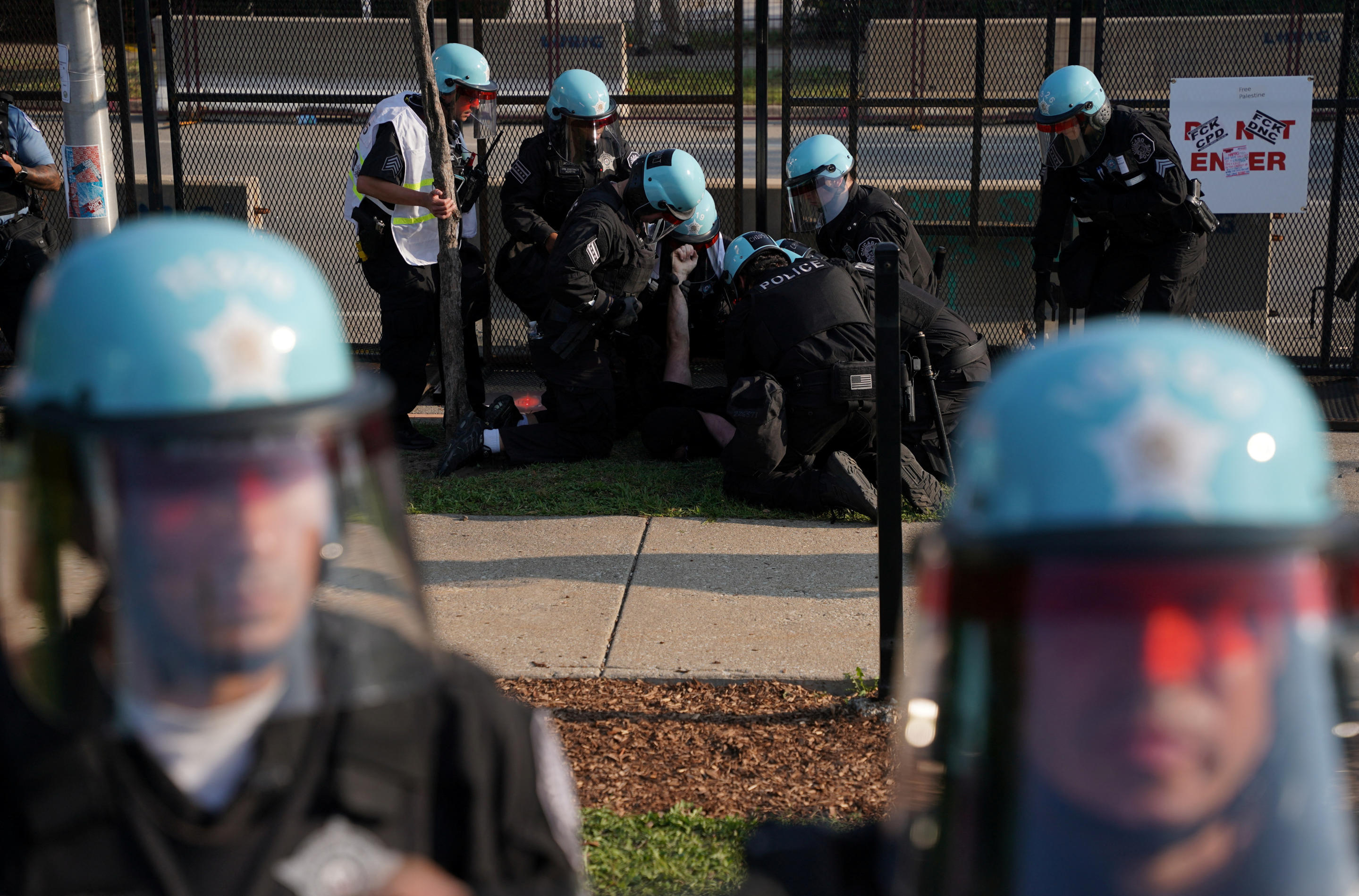 Police arrest a protester outside the Democratic National Convention in Chicago on Monday. (Seth Herald/Reuters)