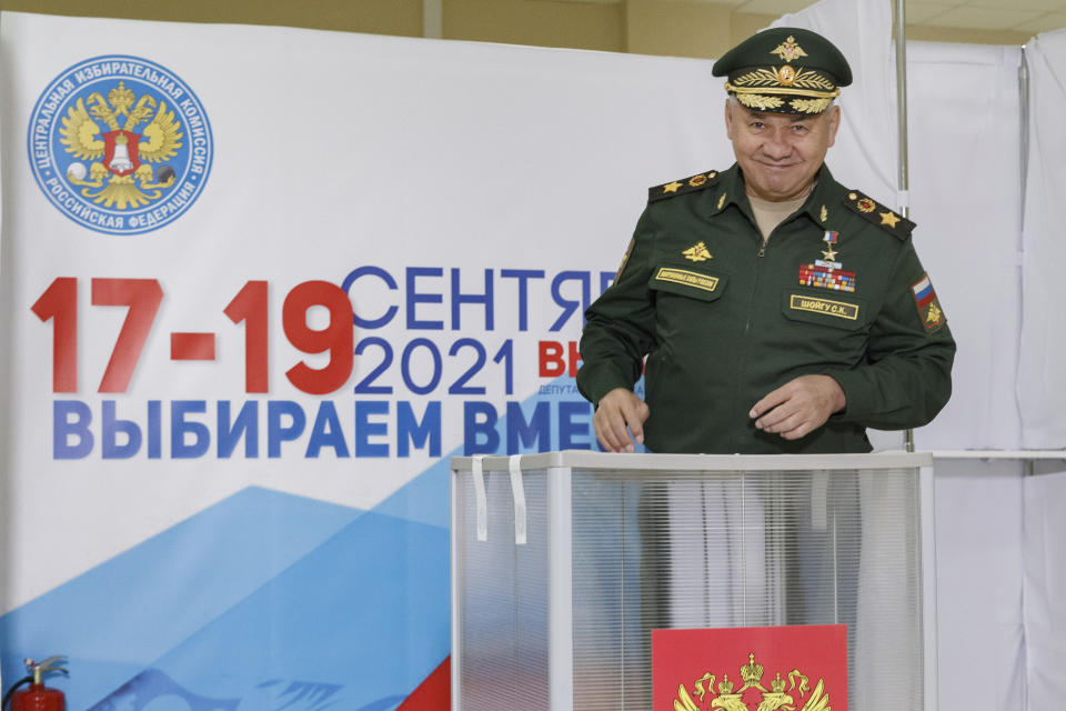 In this handout photo released by the Russian Defense Ministry Press Service, Russian Defense Minister Sergei Shoigu smiles as he casts his ballot at a polling station during the Parliamentary elections in Moscow, Russia, Friday, Sept. 17, 2021. Russia has begun three days of voting for a new parliament that is unlikely to change the country's political complexion. There's no expectation that United Russia, the party devoted to President Vladimir Putin, will lose its dominance in the State Duma. (Vadim Savitsky/Russian Defense Ministry Press Service via AP)