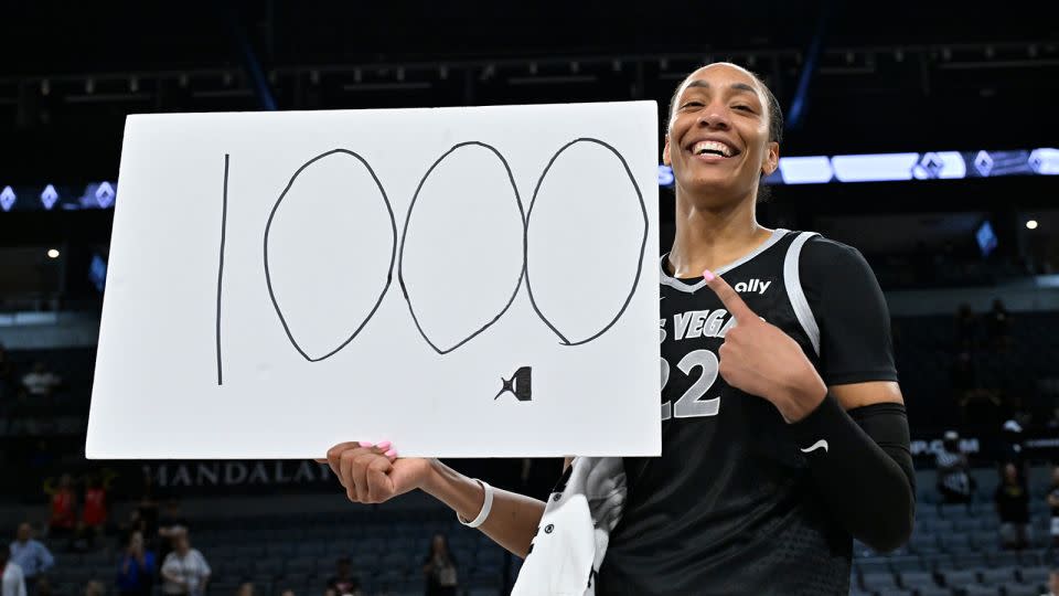 A'ja Wilson #22 of the Las Vegas Aces celebrates after becoming the first WNBA player to score 1,000 points in a single season during the game against the Connecticut Sun on September 15, 2024 at Michelob ULTRA Arena in Las Vegas, Nevada. - David Becker/NBAE/Getty Images