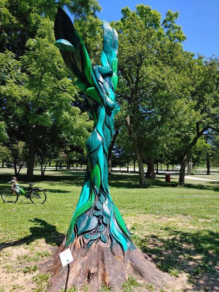 Gary Keenan's "Transformation" stands in Chicago's Jackson Park. The carving was commissioned by the Chicago Tree Project.