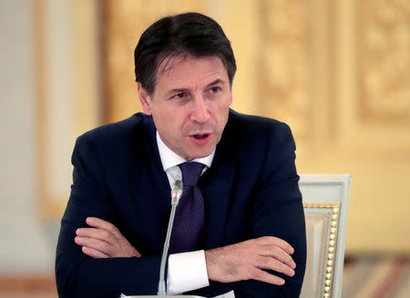 FILE PHOTO: Italian Prime Minister Giuseppe Conte speaks during a meeting with Italian businessmen at the Kremlin in Moscow, Russia October 24, 2018. Sergei Chirikov/Pool via REUTERS/File Photo