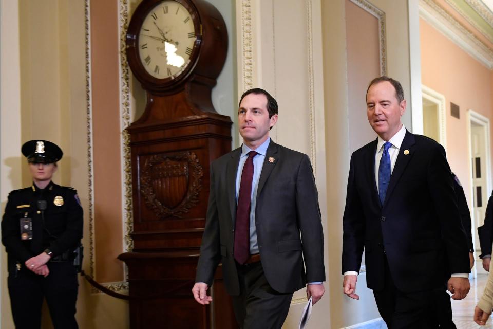 House Democratic impeachment managers Rep. Jason Crow, D-Colo., center, and Rep. Adam Schiff, D-Calif., right, arrive at the Senate on Monday for the impeachment trial of President Donald Trump