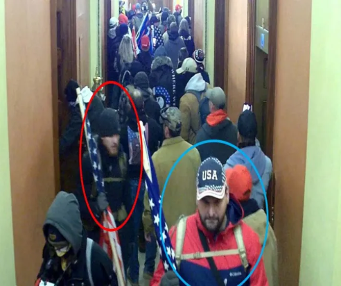 A surveillance camera photo shows Will Pope, circled in blue, and his brother, Michael Pope, circled in red, in a mob that invaded the U.S. Capitol on Jan. 6, 2021.