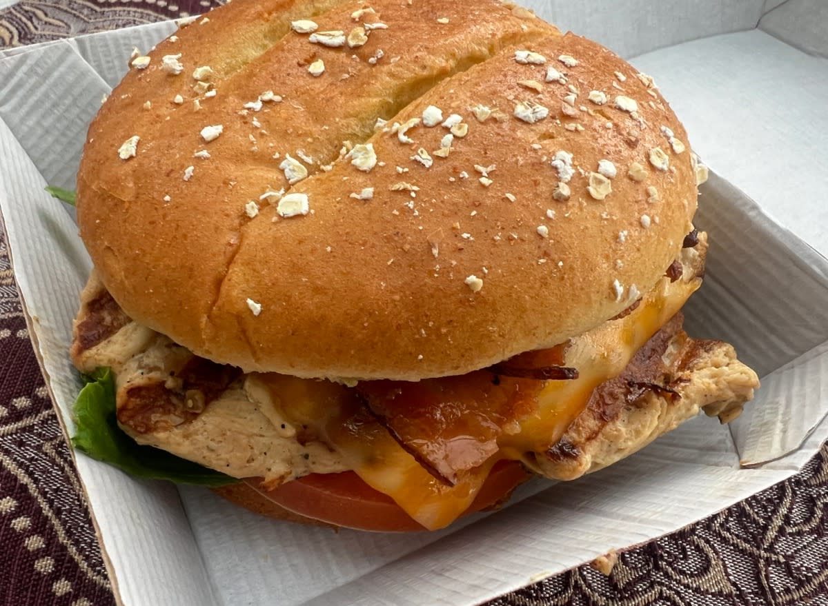 chick-fil-a grilled chicken club sandwich in takeout container.