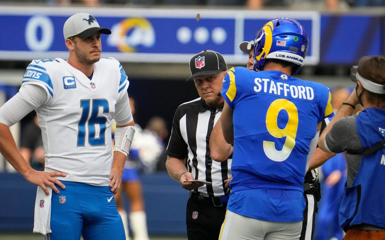 Detroit Lions quarterback Jared Goff, left, and Los Angeles Rams quarterback Matthew Stafford during the coin flip before the start of the game at SoFi Stadium, Oct. 24, 2021 in Inglewood, Calif.