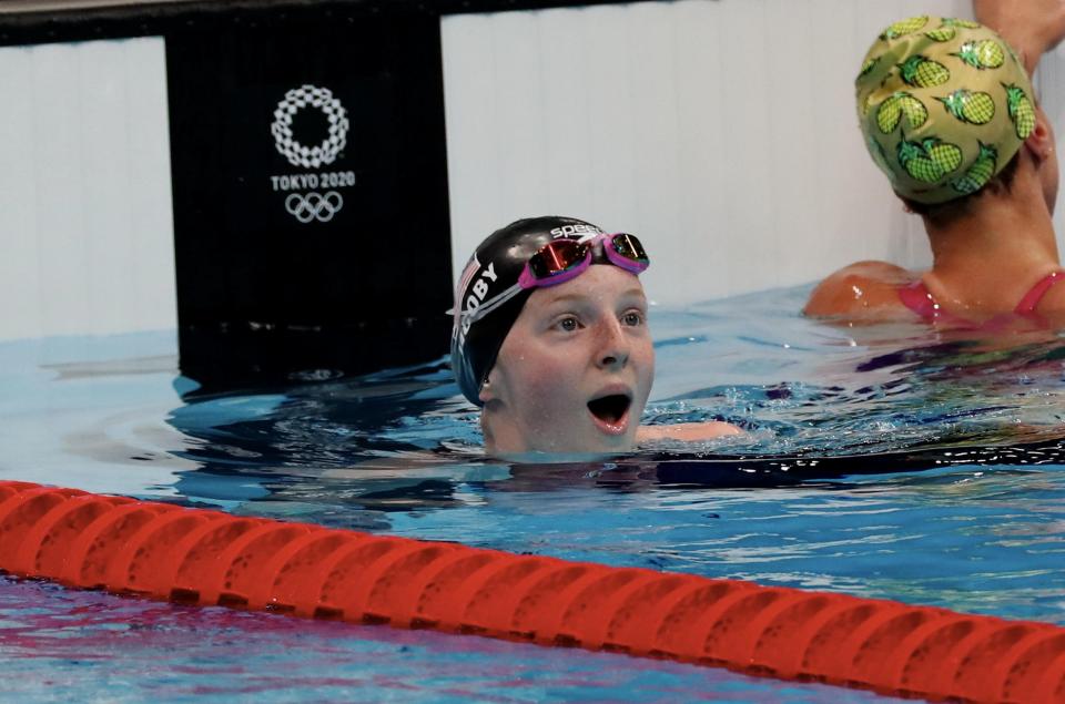 Lydia Jacoby, who won gold at the Tokyo Olympics, looks at the scoreboard to see she's taken the gold in a state of shock.