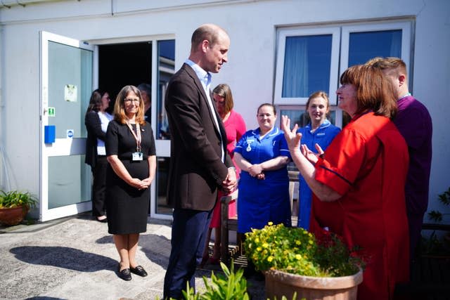 The Prince of Wales chats to people during a visit to the Isles of Scilly