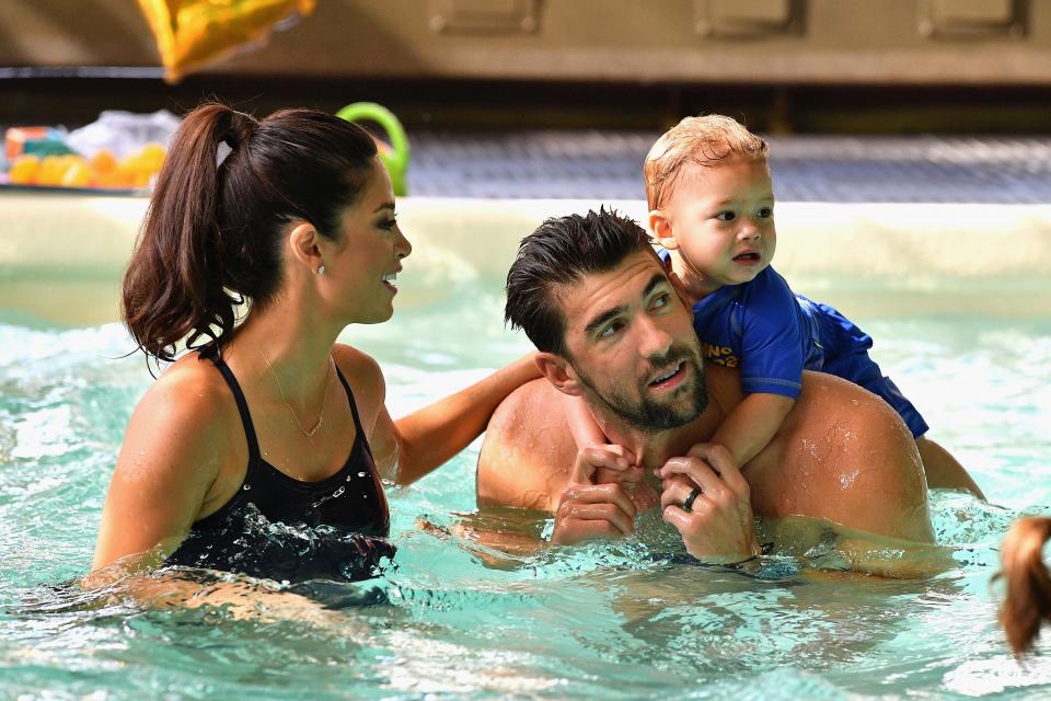 Twenty-three-time Olympic medalist swimmer Michael Phelps and wife Nicole Phelps with son Boomer in 2017.