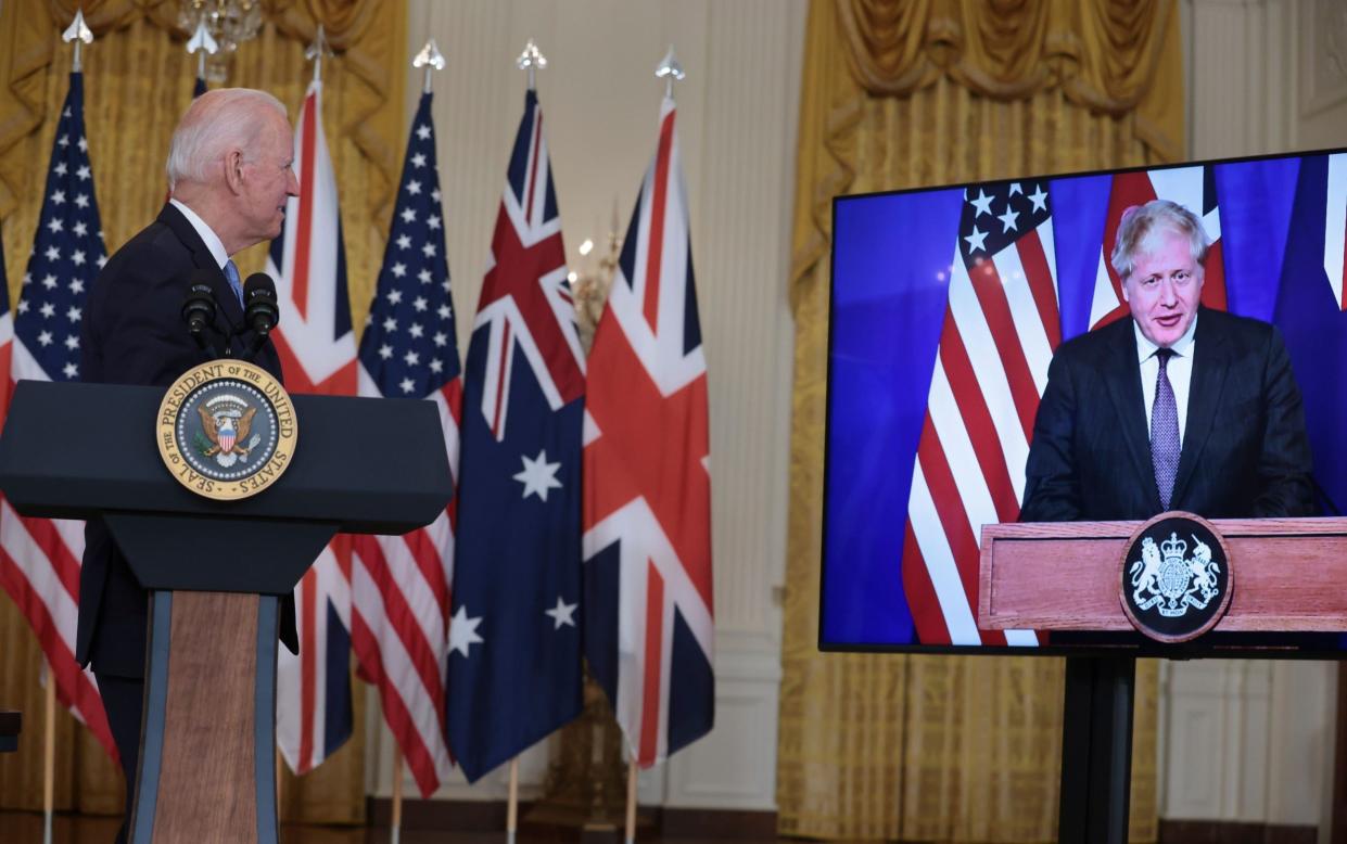 President Joe Biden participates in a virtual press conference on national security initiative in the East Room of the White House in Washington with British Prime Minister Boris Johnson - Oliver Contreras