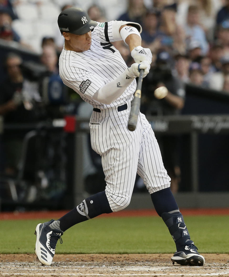 New York Yankees' Aaron Judge hits a two-run home run against the Boston Red Sox during the fourth inning of a baseball game, Saturday, June 29, 2019, in London. Major League Baseball made its European debut game today at London Stadium. (AP Photo/Tim Ireland)