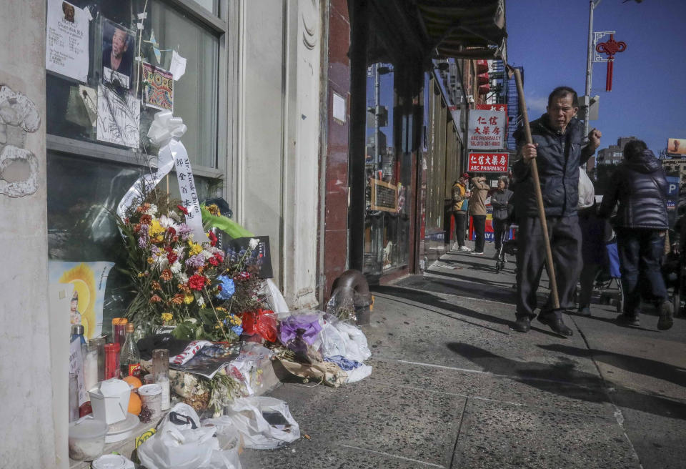 REMOVES REFERENCE TO HOMELESS KILLED - A makeshift memorial stands at the site for Chuen Kok Friday Oct. 18, 2019, in New York. Kok, an 83-year-old homeless man whom Chinatown residents warmly greeted as "uncle," was one of four men bludgeoned to death in the community last week. (AP Photo/Bebeto Matthews)