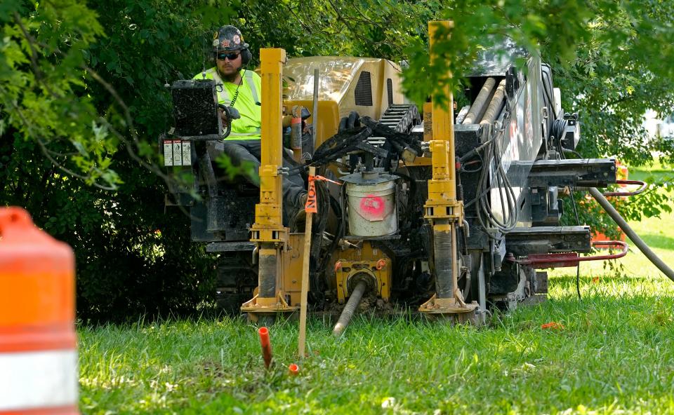 A worker from Five Star Energy Services does horizontal directional drilling on S. Sunny Slope Road in New Berlin, Friday for installation of fiber optics for TDS Telecom customers.