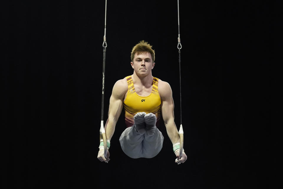 Michael Moran, representing the University of Minnesota, competes during the Winter Cup gymnastics competition, Sunday, Feb. 28, 2021, in Indianapolis. A junior from Morristown, New Jersey, Moran admits there were people within his inner circle who discouraged him from competing collegiately because they viewed his chosen sport as a “dying entity.” The University of Minnesota and the University of Iowa will stop offering it as a scholarship sport at the end of the month. (AP Photo/Darron Cummings)