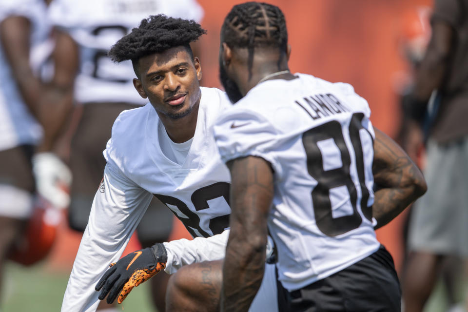 Cleveland Browns receiver Rashard Higgins, left, talks with receiver Jarvis Landry in-between reps during NFL football practice in Berea, Ohio, Wednesday, July 28, 2021. (AP Photo/David Dermer)