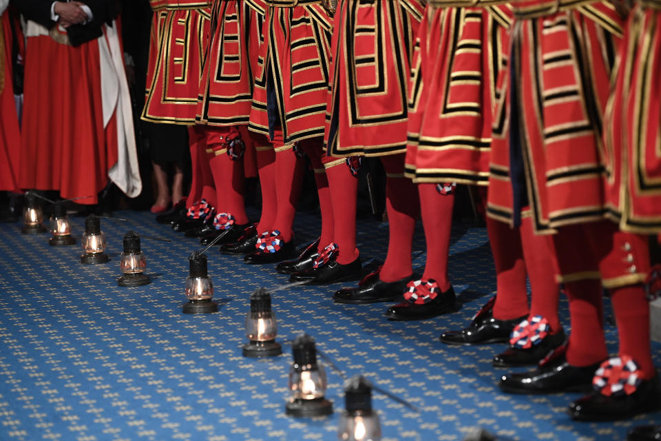 Yeoman warders march in the houses of Parliament to start the ceremonial search which is the opening event of the annual state opening of Parliament at the House of Lords, in London, Tuesday, May 10, 2022. Britain’s Parliament is opening a new year-long session with Prime Minister Boris Johnson trying to re-energize his scandal-tarnished administration and address the U.K.’s worsening cost-of-living crisis. (Eddie Mulholland/Pool Photo via AP)