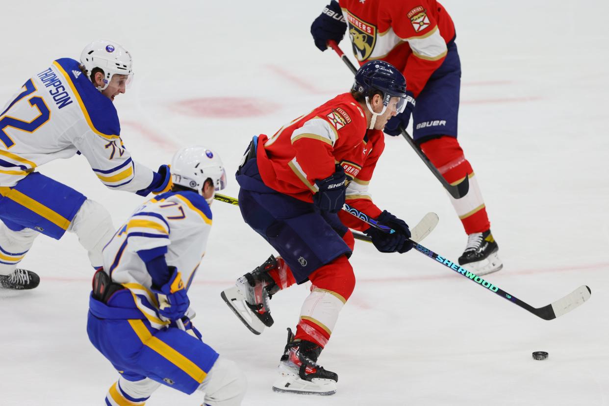 Apr 13, 2024; Sunrise, Florida, USA; Florida Panthers left wing Matthew Tkachuk (19) moves the puck past Buffalo Sabres center Tage Thompson (72) during the third period at Amerant Bank Arena. Mandatory Credit: Sam Navarro-USA TODAY Sports