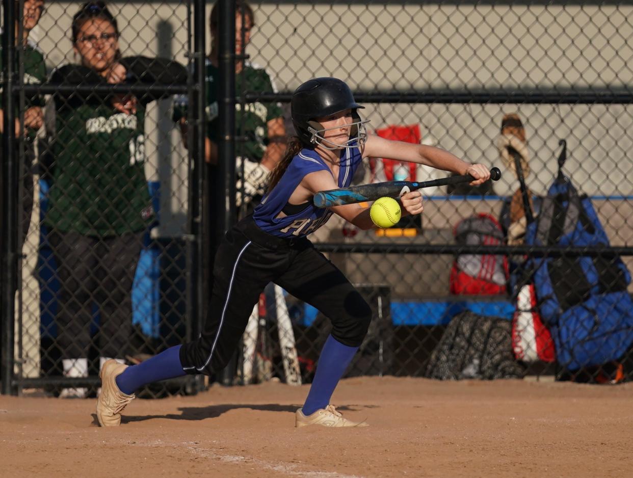 Pearl River's Taylor Donnelly (15) lays down a bunt during their 9-0 win over Brewster in the opening round of Section 1 Class A softball action at Pearl River High School in Pearl River on Thursday, May 18, 2023.