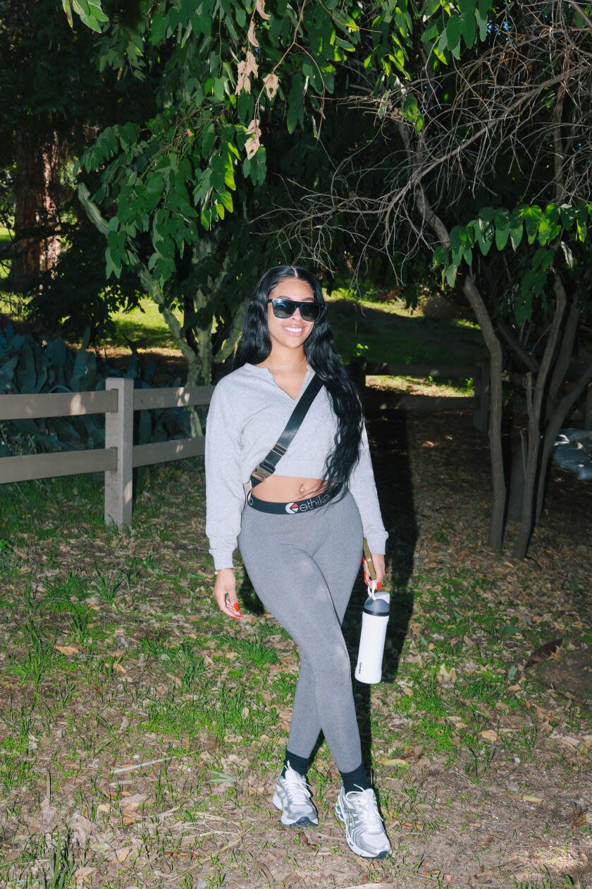 Denai Blackshire poses for a portrait with her Owala water bottle at Runyon Canyon.